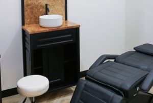Professional salon chair and high-quality furnishings in a Freedom Suites suite