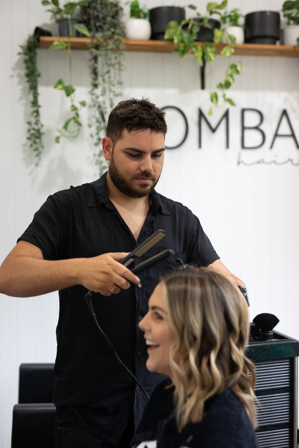 Stylist straightening hair