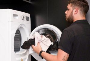 Well-equipped kitchen and laundry facilities at Freedom Suites